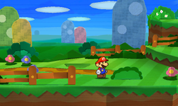 Mario near a bush containing a Heart in Warm Fuzzy Plains of Paper Mario: Sticker Star.