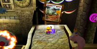 Wario collecting one of his treasures in Wario World