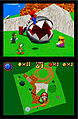 The four heroes fighting the Chain-Chomp in Bob-omb Battlefield. The textures are different, such as the brighter grass, and dark-green rocks seen on the map that look the same as the original's.