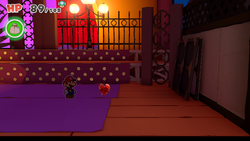 Mario standing near a Healing Heart in Big Sho' Theater of The Origami King.