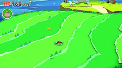 Mario standing near 3 10-Coins on Club Island of The Origami King.