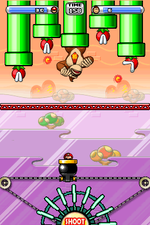 A screenshot of the battle against Donkey Kong in Boss Game 3 from Mario vs. Donkey Kong 2: March of the Minis.