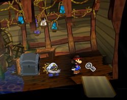 Mario getting the Black Key from an Ember in Pirate's Grotto of Paper Mario: The Thousand-Year Door.