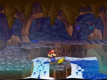 Mario getting the Star Piece above a small plaform in the first spike room of Pirate's Grotto in Paper Mario: The Thousand-Year Door.
