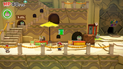 Mario standing near a Shiny Hammer in Picnic Road of The Origami King.