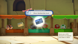 Mario being given the Silver Membership Card by the item shop shopkeeper in Picnic Road of The Origami King.