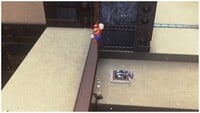 Mario at the peak of a Ground Pound Jump in Bowser's Kingdom in Super Mario Odyssey.