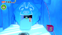 Mario standing near a Shiny Ice Flower on Ice Vellumental Mountain of The Origami King.