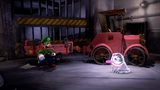 Luigi attempting to suck up a Polterpup in the garage, with a old red car attached to a flat bed