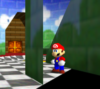 The black room of death glitch from Super Mario 64. Mario is behind a wall.