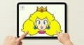 Peach's hair being pulled on an iPad