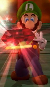 Luigi holding King Boo's crown in Luigi's Mansion