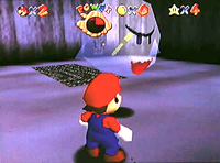 Pre-release screenshot of Super Mario 64, where Mario sees a Key inside of a Big Boo.
