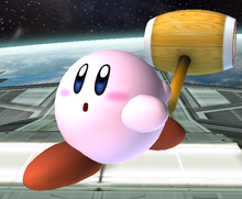 Kirby swings his Hammer in Super Smash Bros. Brawl.