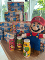 Actimel packs and bottles, alongside a Mario plush toy, at Danone's office in Rueil-Malmaison, France