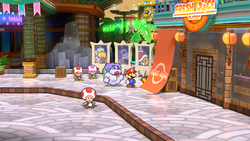 Mario near the Inn Coupon in Glitzville of Paper Mario: The Thousand-Year Door for Nintendo Switch.