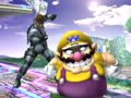 Snake places a C4 on Wario