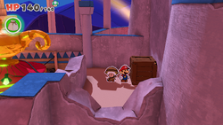 Mario standing near a crate containing a Shiny Hurlhammer in Shroom City of The Origami King.