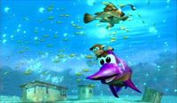 Diddy Kong passing Glimmer the Anglerfish on a purple Enguarde