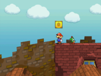 Mario next to the Shine Sprite on the roof of the north house in the east area of Rogueport in Paper Mario: The Thousand-Year Door.