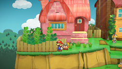 Mario near the three Turtley Leaf plants in Petalburg of Paper Mario: The Thousand-Year Door for Nintendo Switch.