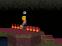Screenshot of Mario revealing a hidden ? Block (containing a Boo's Sheet) in the Palace of Shadow, in Paper Mario: The Thousand-Year Door.