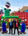 Luigi, Shinya Takahashi, Shigeru Miyamoto, and Mario on the day of the grand opening