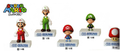 Super Mario Figure Collection Series 2, which contains Fire Mario, Fire Luigi, Baby Mario, Baby Luigi, and a Super Mushroom