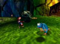 Chunky Kong holding a boulder in Donkey Kong 64.