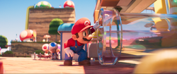 Mario admiring a Clear Pipe before getting sucked into it.