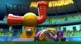 Wario and Waluigi duck under a cannon after sabotaging it with a Bullet Bill.