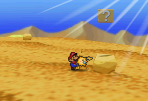 Image of Mario revealing a hidden ? Block in Dry Dry Desert, in Paper Mario.