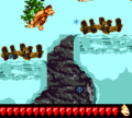 Dixie jumping over a pitfall, hence the level's name.