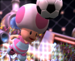 A Toad from Peach's team headbutts the ball