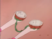 Princess Toadstool holding a Coconut telephone.