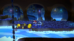 Mario near 6 Coins on the Boat Mode panel in the waterfall area in Pirate's Grotto of Paper Mario: The Thousand-Year Door for Nintendo Switch.