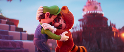 Tanooki Mario rescues Luigi in The Super Mario Bros. Movie.