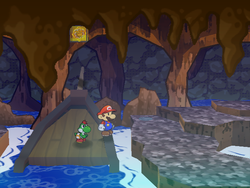 Mario next to the Shine Sprite near the entrance of the Pirate's Grotto in Paper Mario: The Thousand-Year Door.