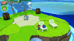 Mario standing near a Small Bag of Confetti on Spade Island of The Origami King.