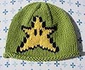 A green hat with a Super Star picture on the front