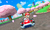 E3 2010 screenshot of Mario racing in Mario Circuit from Mario Kart 7.