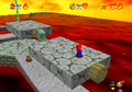 Mario on a tilting platform in Super Mario 64
