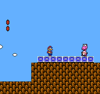 Mario fighting Birdo in Super Mario Bros. 2.