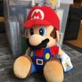 A plushie of Mario and F.L.U.D.D. from Super Mario Sunshine by SegaPrize