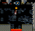 Mario jumping right under a Lava Bubble while avoiding the logs with thorns on them in the level Valley Fortress.