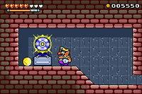 Wario standing near a 500 Coin and CD
