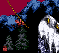 Diddy swinging from a rope over a pit in the Game Boy Color version