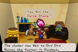 Mario receiveing Pulse Stone from Moustafa in Dry Dry Outpost of Paper Mario.