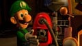 The first image shown in the article, showing Luigi finding the Poltergust 5000.