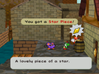 Mario getting the Star Piece behind a barrel in the back side of east Rogueport in Paper Mario: The Thousand-Year Door.